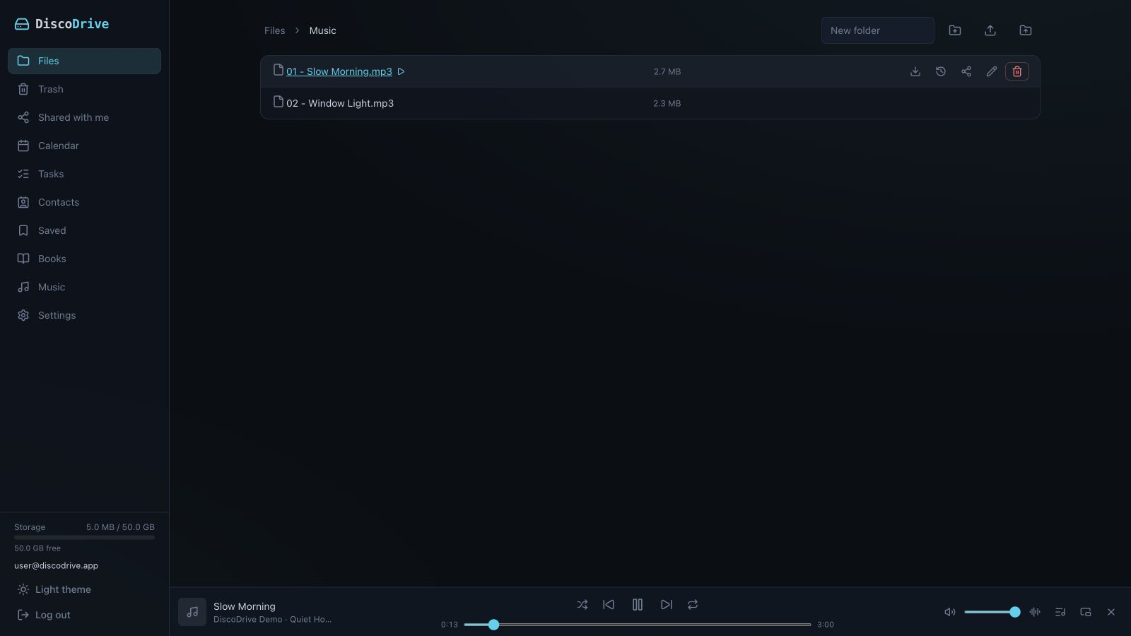 The music section of the DiscoDrive web interface: a track list and the player panel along the bottom of the window.